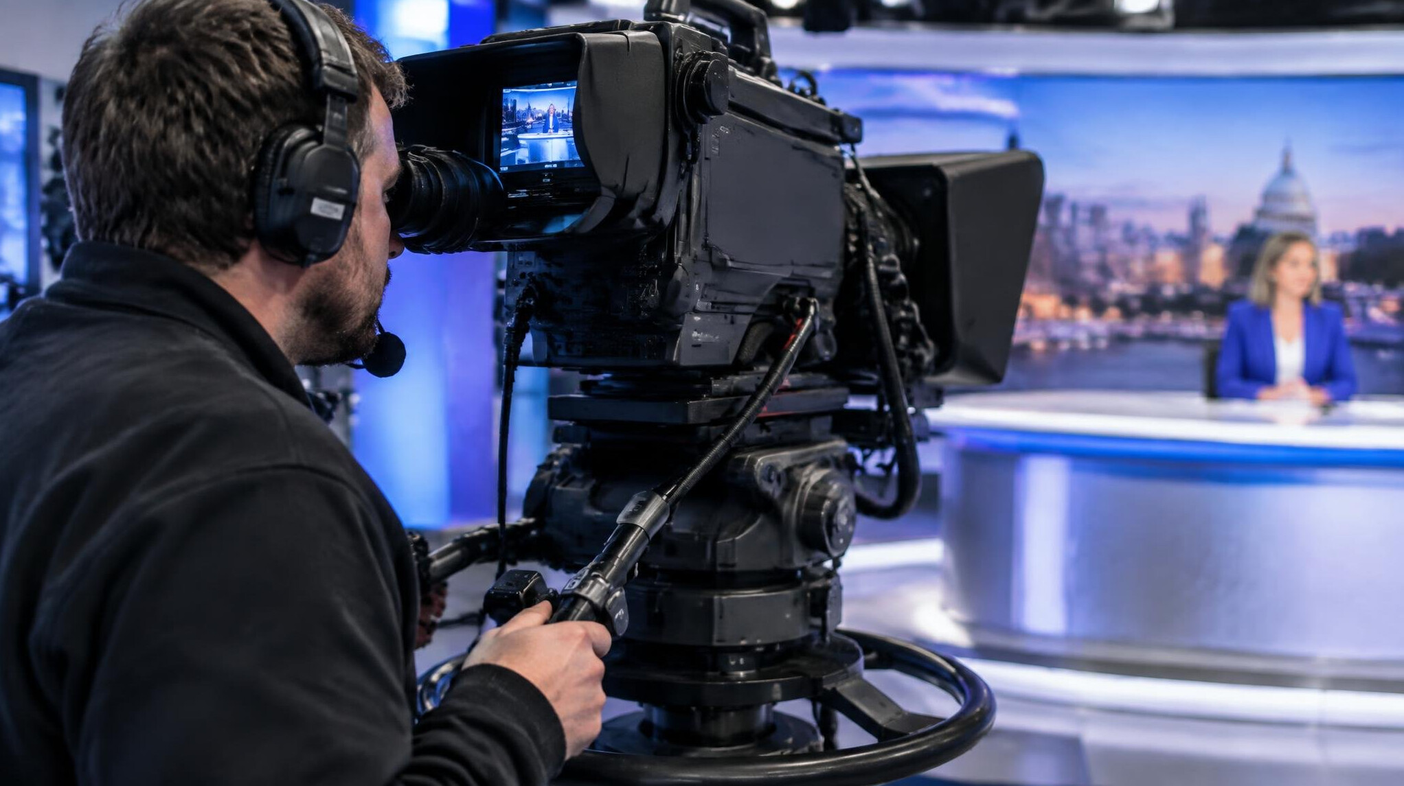 Camera operator filming during a live television broadcast