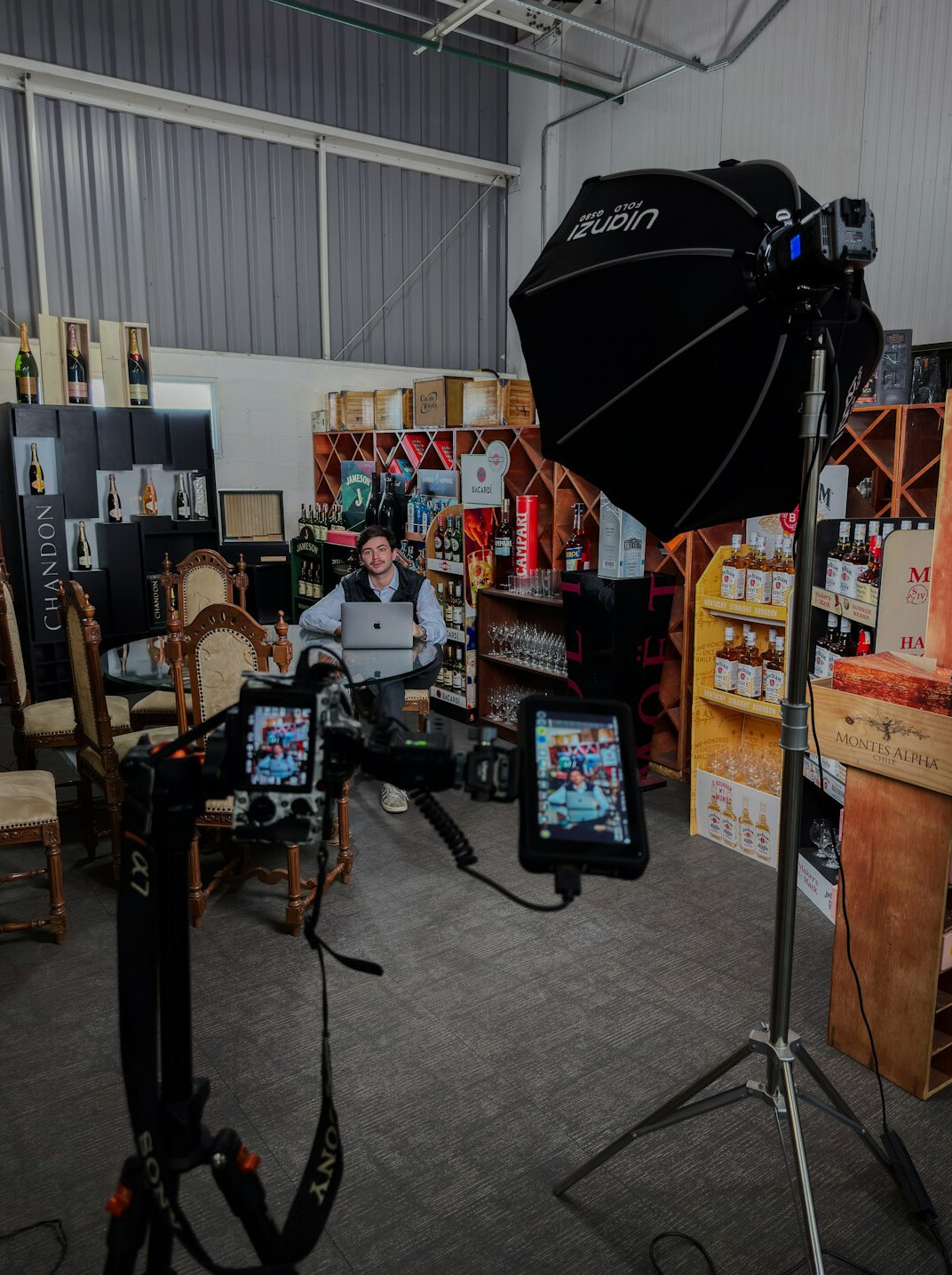 Multi-camera television studio set with lighting rigs